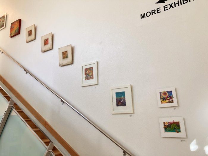 photo of pictures framed artistically along a staircase