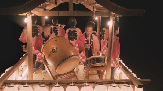 Still from the movie Bon-Uta, A Song from Home of women dancing in traditional Japanese garb.