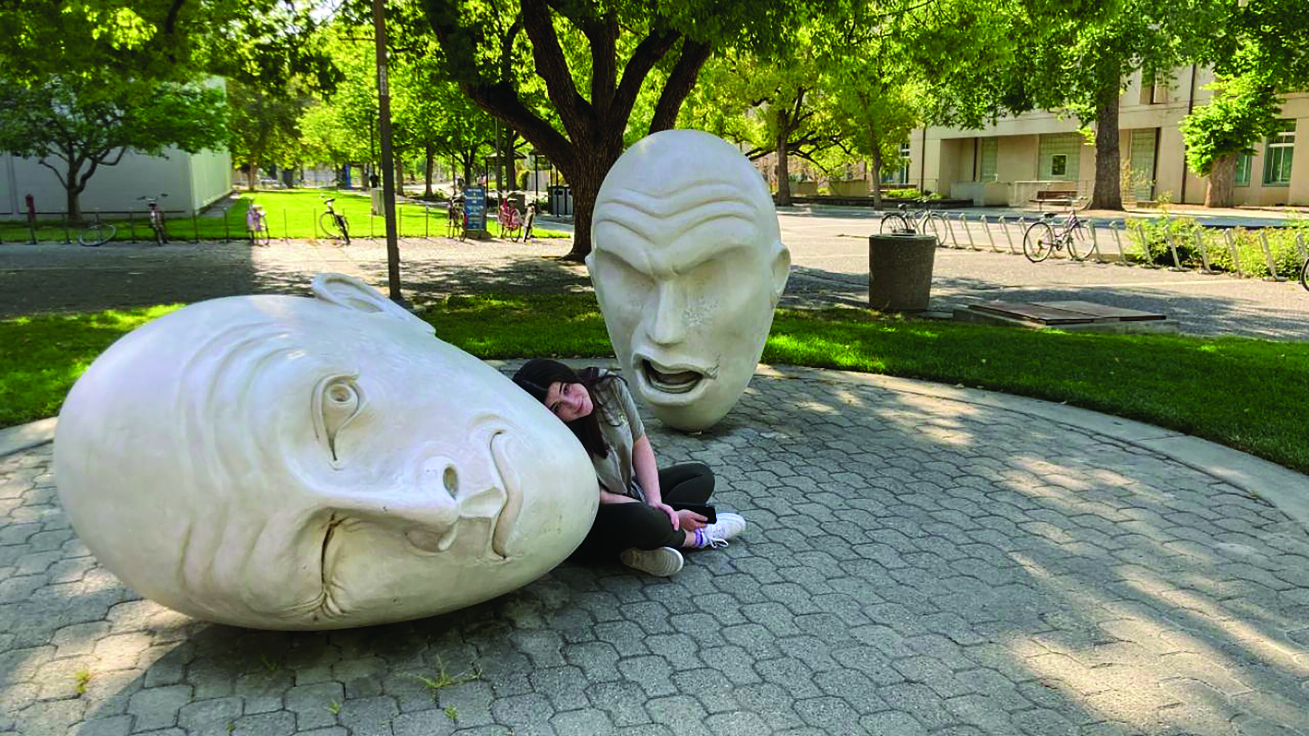 UC Davis student Jamie Gelfond with Yin & Yang Egghead sculpture during her tour in 2021. (Rhonda Gelfond)